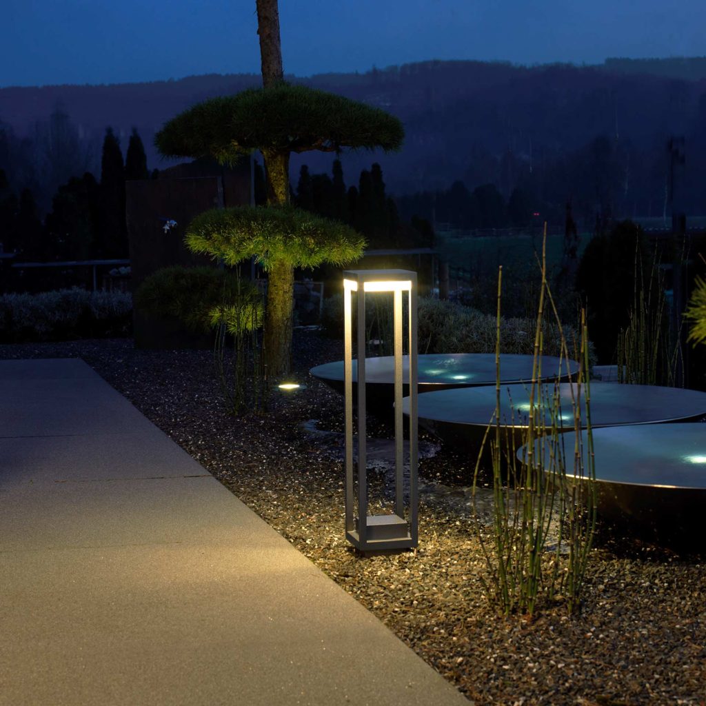 A beautifully designed path light sets the scene for a modern garden.