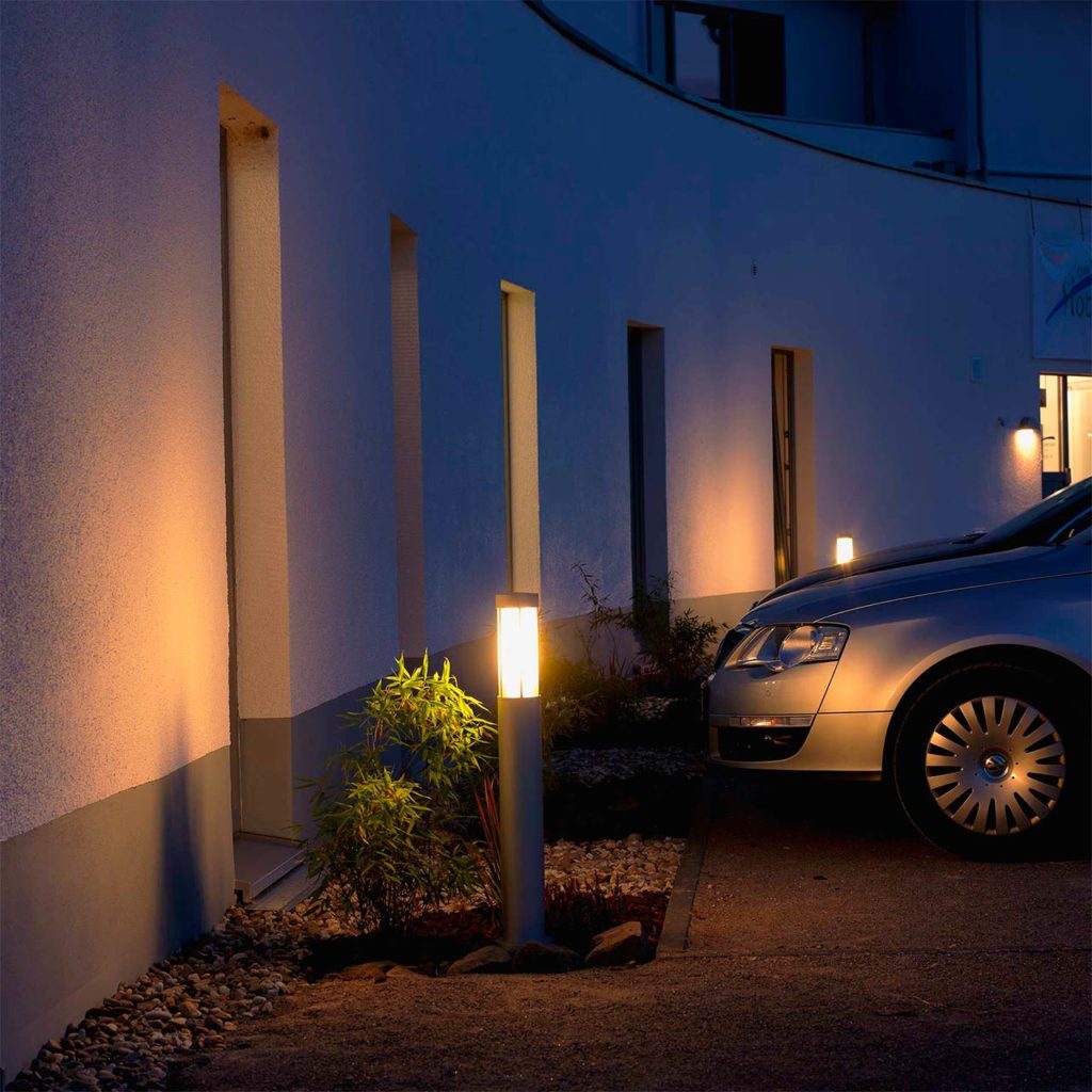 A stainless steel car park lighting provides brightness and safety at a private parking space.